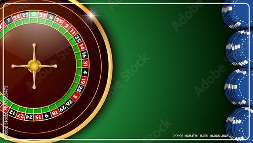 Casino roulette wheel with casino chips on green casino table