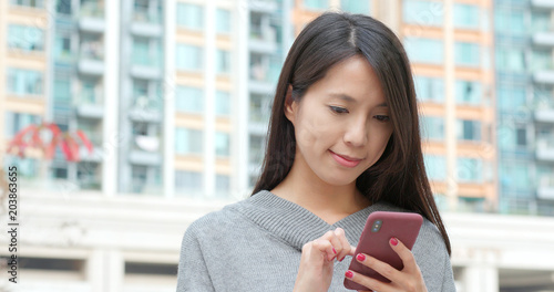 Photography Woman work on smart phone in city