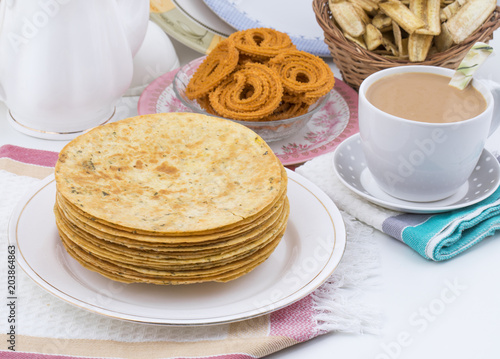 Indian Khakhra is a Traditional Gujarati Snack Also Know As Khakra, Crispy Roti or Fenugreek khakra, Khakhara’s are thin crackers made from wheat flour and oil. It is served usually during breakfast photo