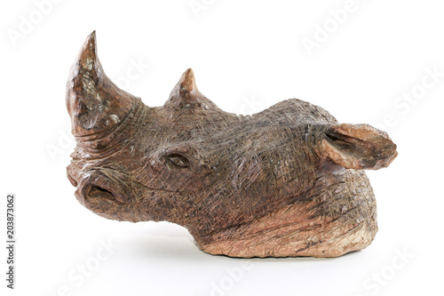 Wooden hand crafted rhinoceros from africa on white clean background 
