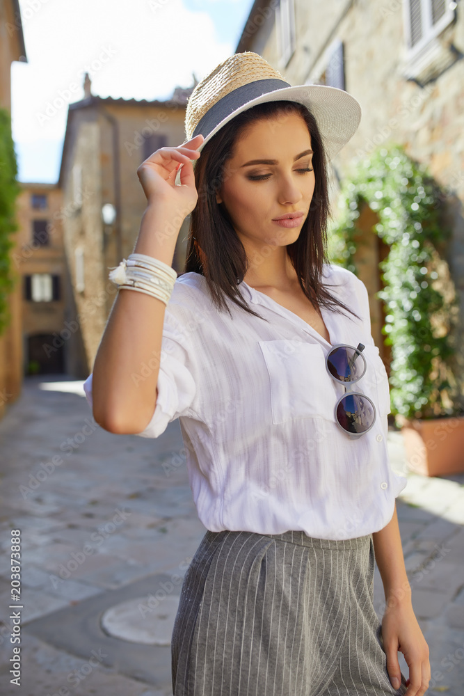 Young tourist woman walks in the old town. Italy.