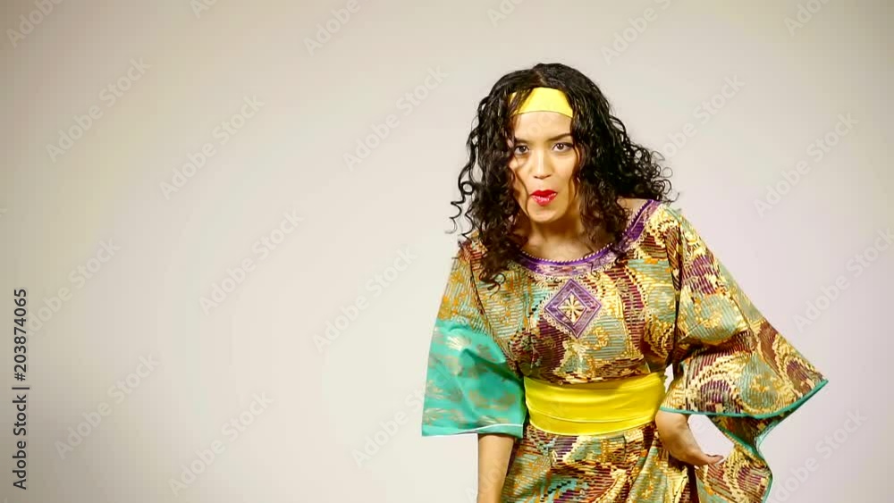 black woman with huge Afro hair having fun smiling and dancing in Studio black woman with huge Afro hair having fun smiling and dancing in Studio