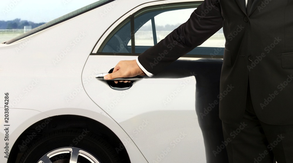 Chauffeur hand opening car door Chauffeur hand opening car door
