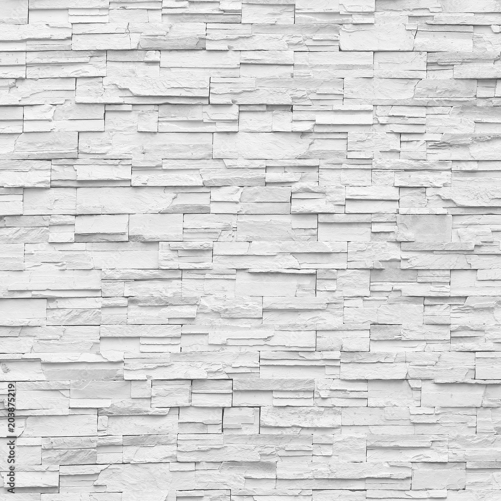 Surface white wall of stone wall gray tones for use as background. Surface white wall of stone wall gray tones for use as background.