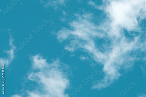 small clouds in the blue sky. Evening sky with lots small clouds - natural background .