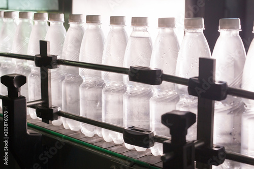 Water factory - Water bottling line for processing and bottling pure spring water into small bottles photo