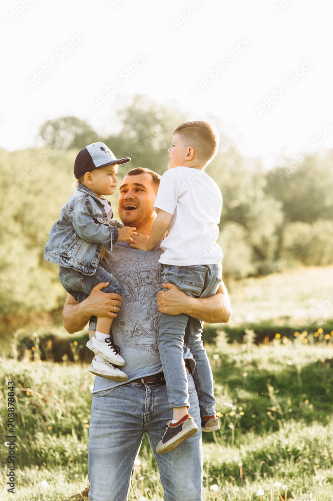 Fototapeta premium family father and two sons