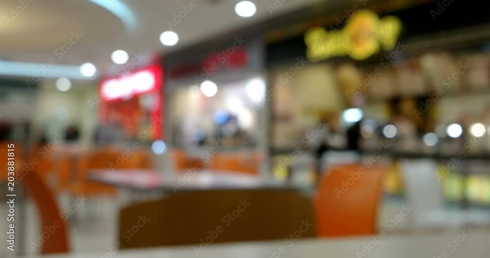Blurred defocused people in food court indoor Blurred defocused people in food court indoor