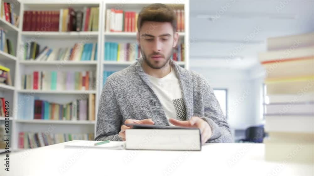 student reading book in school library. Study lessons for exam. Hard worker concept. student reading book in school library. Study lessons for exam. Hard worker concept.