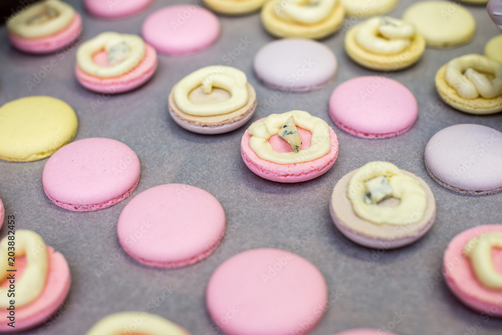 cooking, confectionery and baking concept - macarons on table cooking, confectionery and baking concept - macarons on table