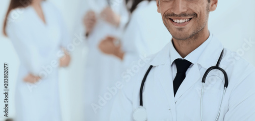 smiling doctor therapist on blurred background.