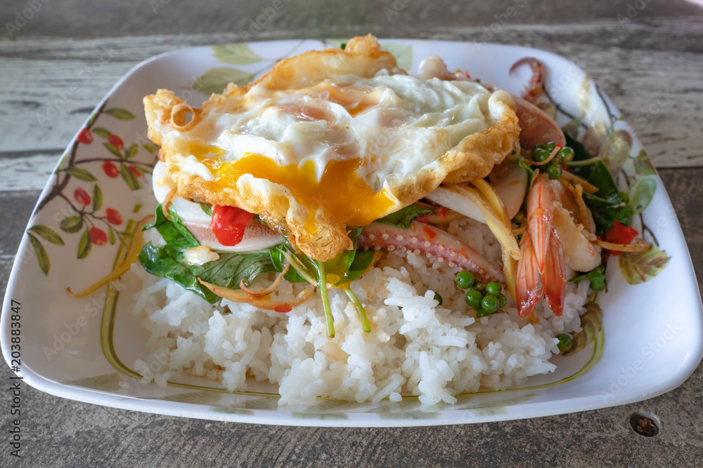 Stir-fried sea food and basil leaves- Served with rice Stir-fried sea food and basil leaves- Served with rice