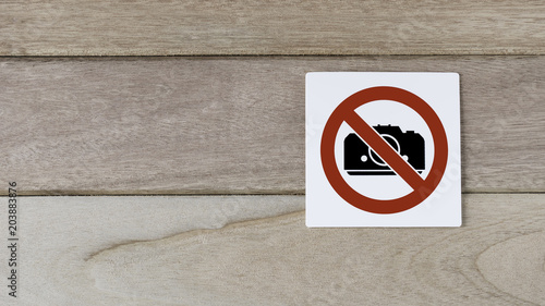 no camera, photography sign on wood wall with space on the left side for adding text