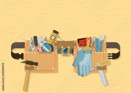 Tools in tool belt with side release buckle strap on wood background, for construction, repair and DIY concept