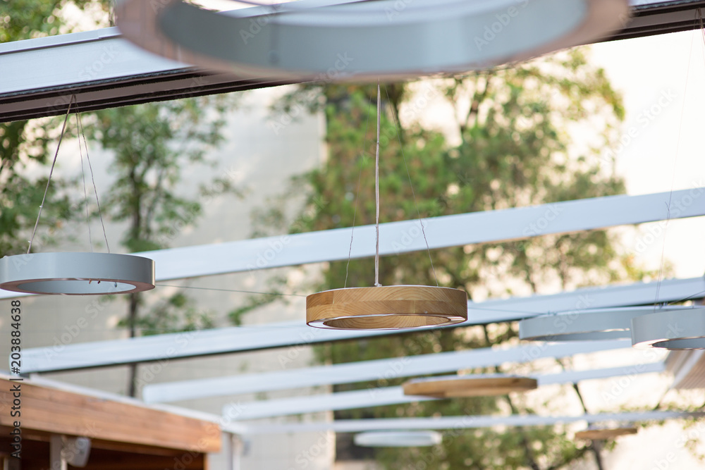 Obraz premium Ceiling lights in summer terrace restaurant