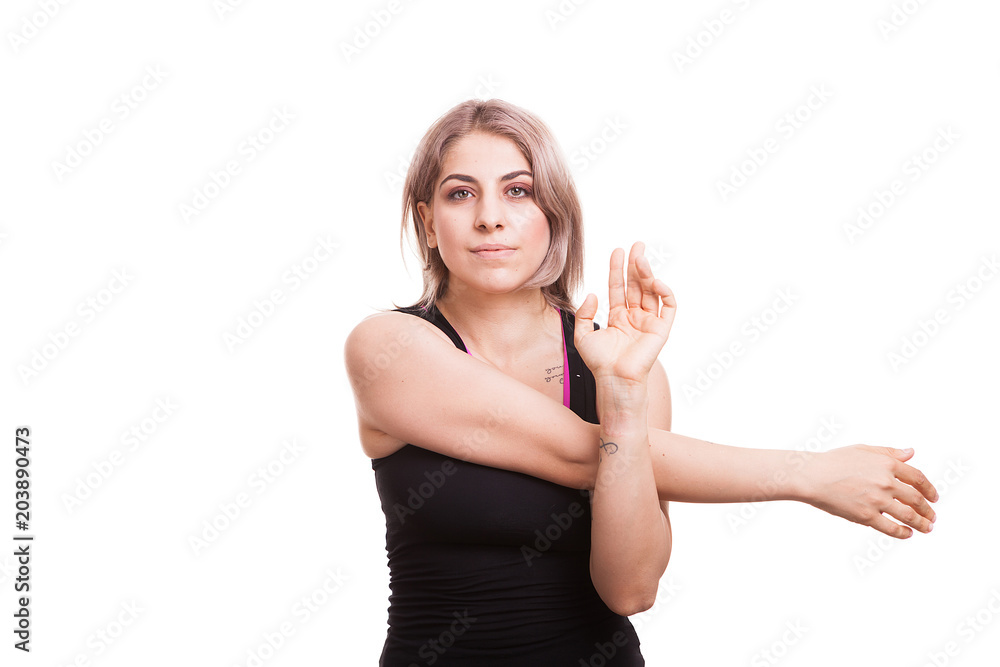 Young fit woman making sport in studio photo over white background Young fit woman making sport in studio photo over white background