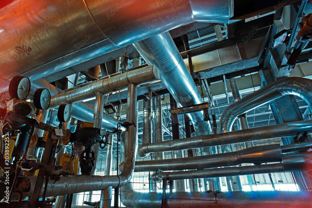 Equipment, cables and piping as found inside of a modern industrial power plant Equipment, cables and piping as found inside of a modern industrial power plant