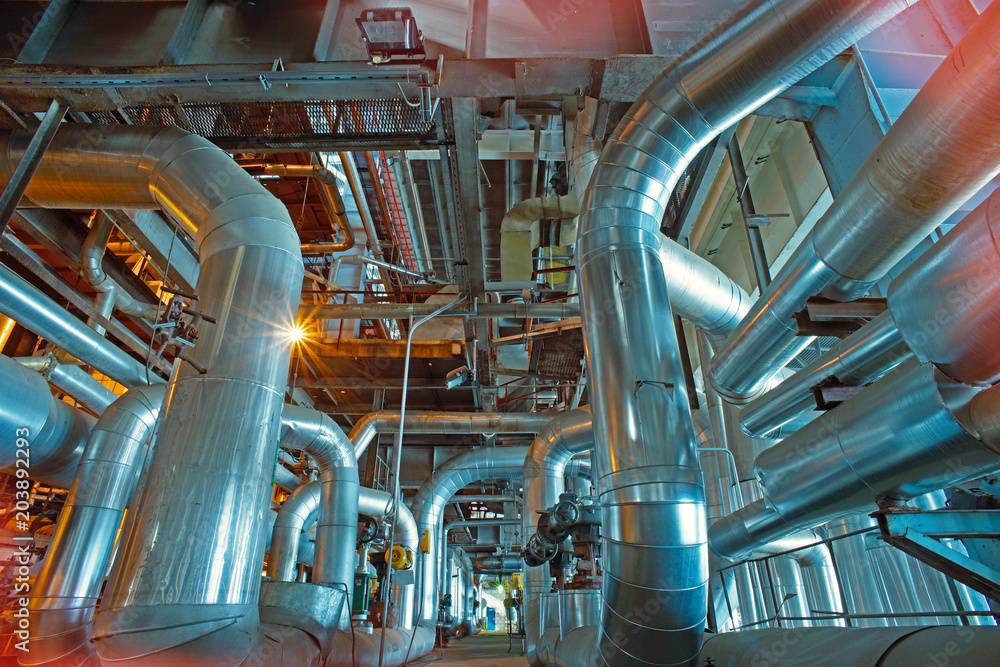 Equipment, cables and piping as found inside of a modern industrial power plant Equipment, cables and piping as found inside of a modern industrial power plant