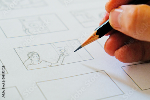 close-up hand drawing storyboard