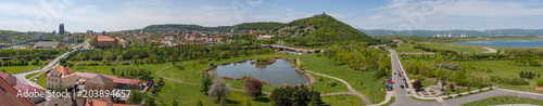 Most Brux city town panorama cemetery church suburb, recultivated coal mine area, Czech republic