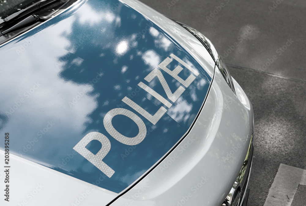 Obraz premium German News Concept: Blue Police Car, Selected Focus