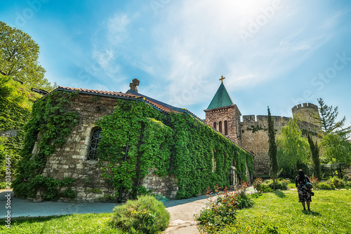 Belgrade, Serbia April 24, 2018: Ruzica Church in Kalemegdan fortress, hole building is covered with clambering plant.  photo