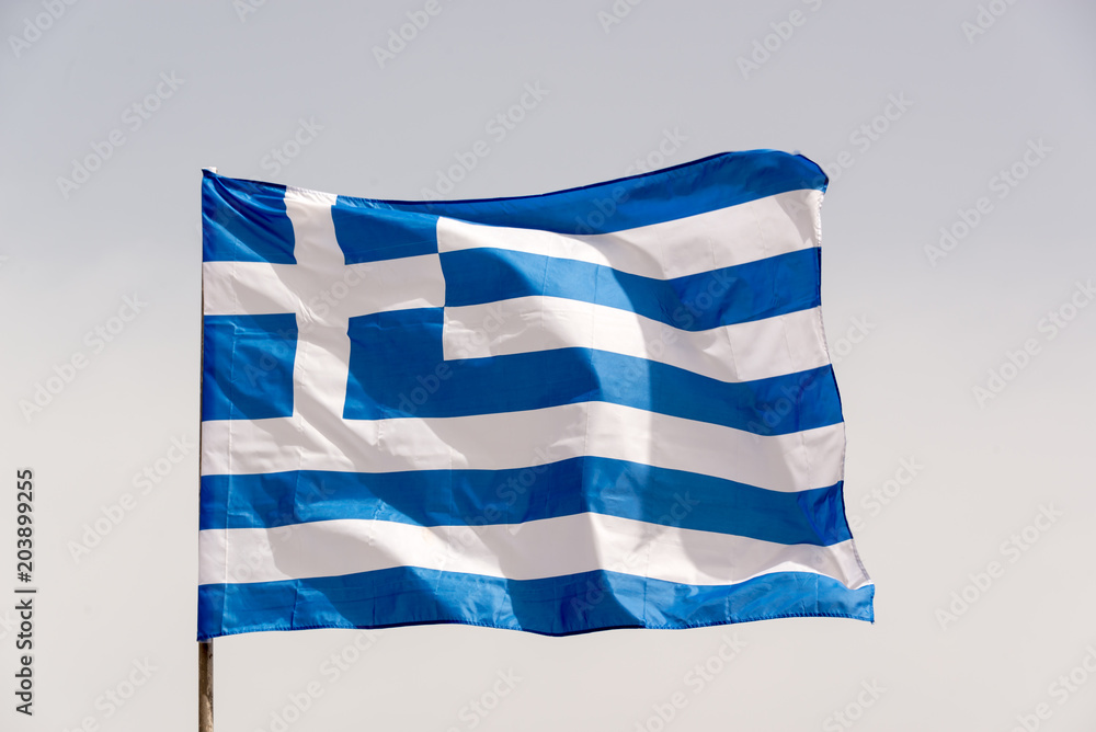 Obraz premium Greek flag on a pole floating in the wind