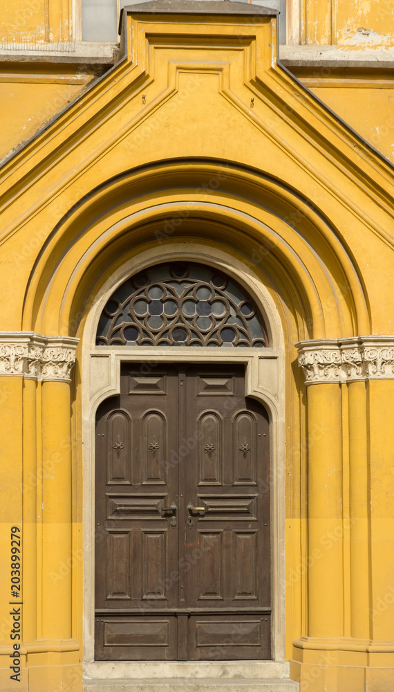 yellow front door of church