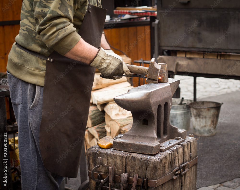 blacksmith working with anvil blacksmith working with anvil