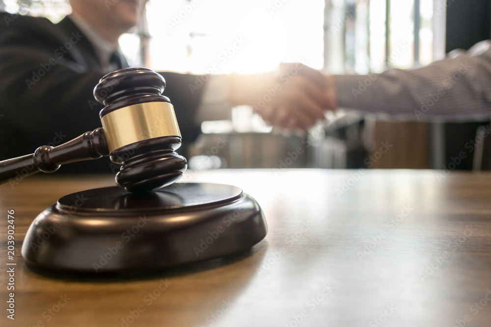 tribunal and justice concept Consultation with insurance lawyer hand shaking tribunal and justice concept Consultation with insurance lawyer hand shaking
