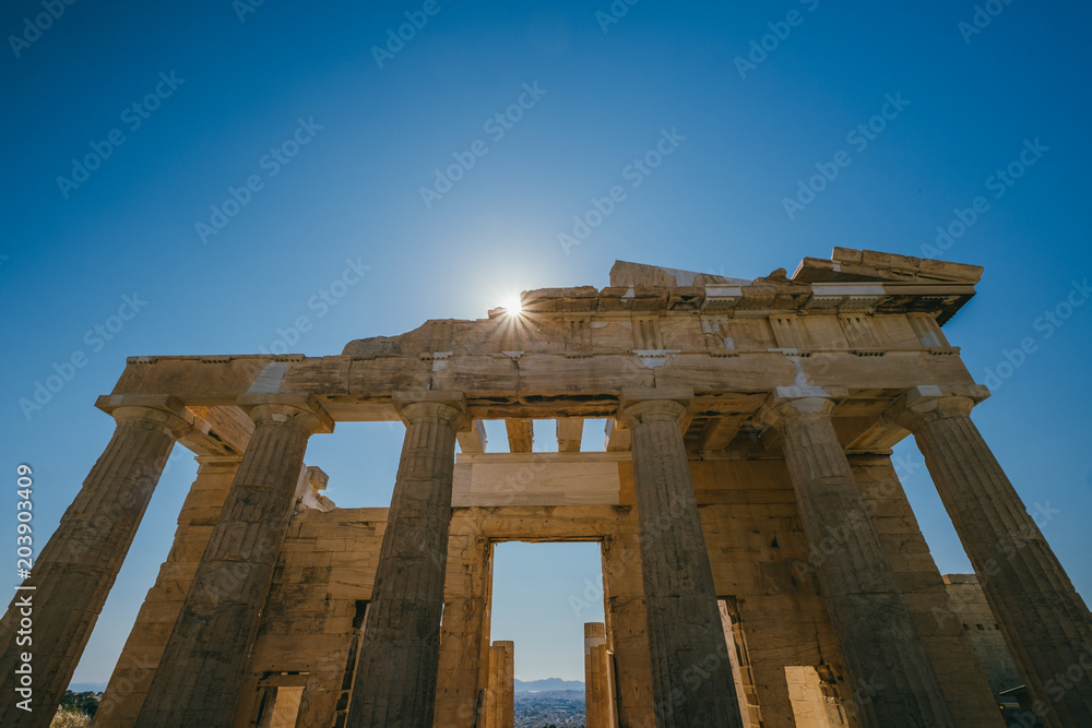Sun at the Erechtheum temple in Acropolis at Athens, Greece Sun at the Erechtheum temple in Acropolis at Athens, Greece