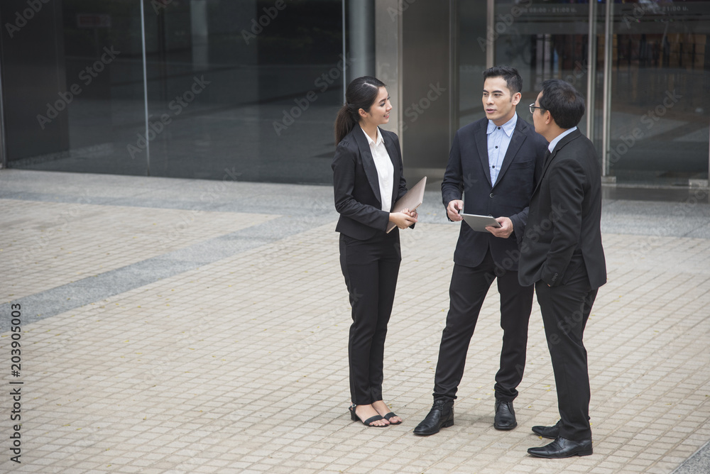 Businessman and businesswoman partner consulting and discussing at outdoor. Businessman and businesswoman partner consulting and discussing at outdoor.