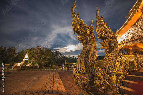Naga statue standing in front of the church.