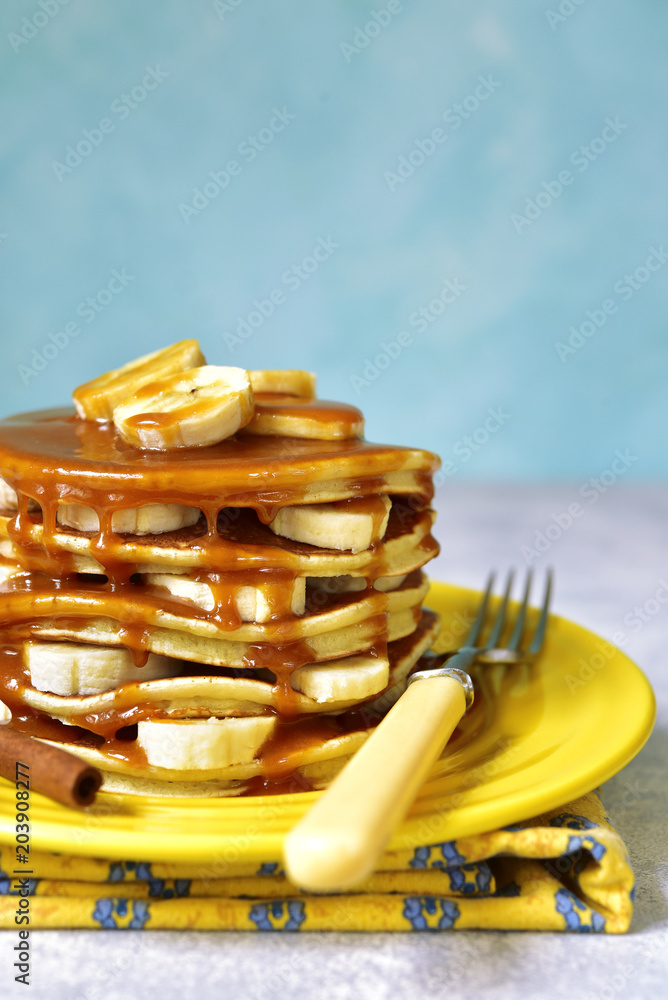 Banana pancakes with caramel for a breakfast.