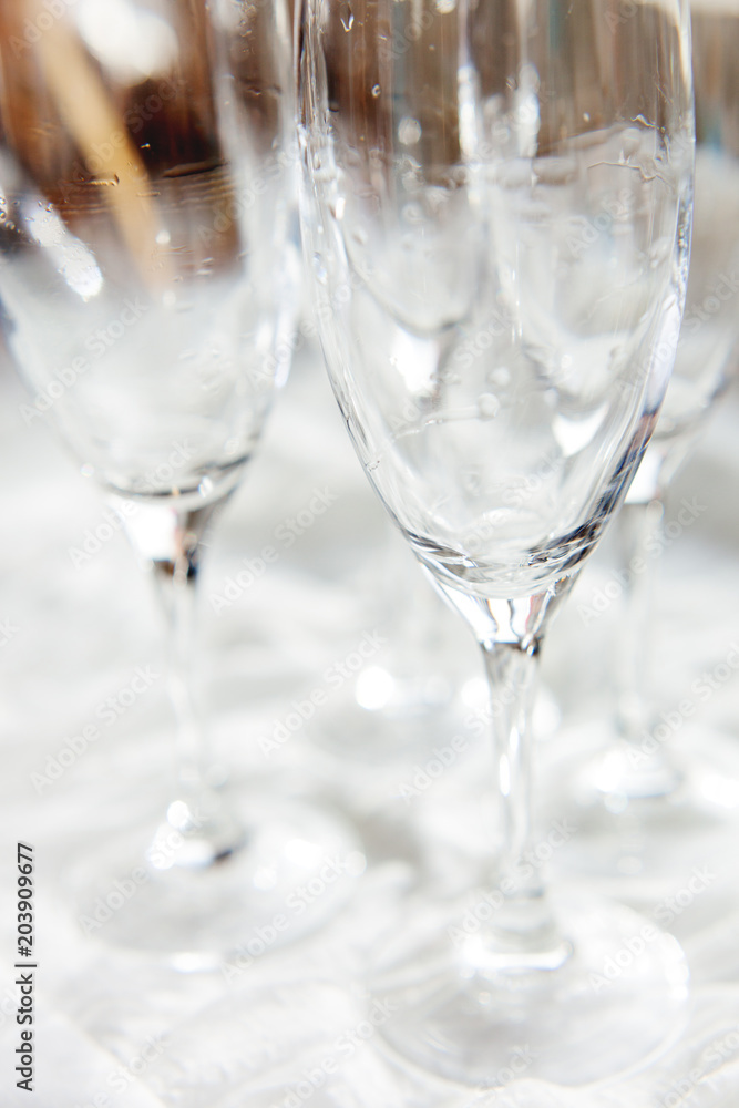 Wet transparent drinking glasses, clear wineglasses after washing. Wet transparent drinking glasses, clear wineglasses after washing.