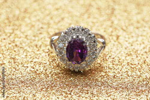 purple gemstone on diamond ring