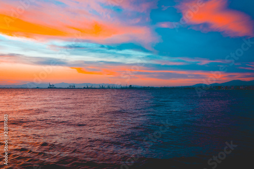 Colorful vivid orange sunset over a calm ocean