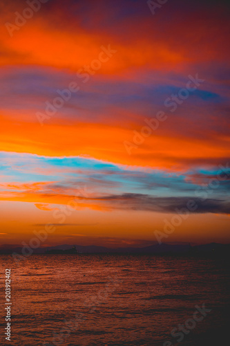 Dramatic bright vivid orange marine sunset © Robert Herhold