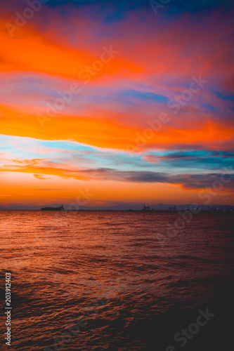 Spectacular vibrant orange tropical ocean sunset © Robert Herhold