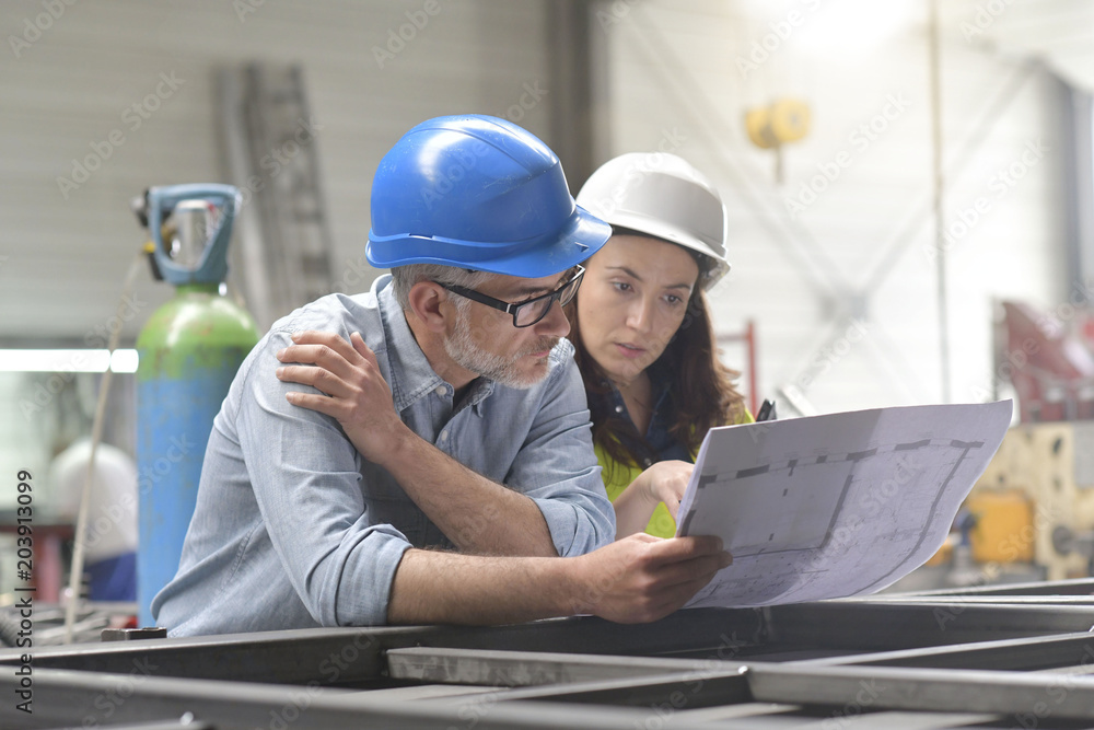 Metal industry manager and engineer meeting in factory Metal industry manager and engineer meeting in factory