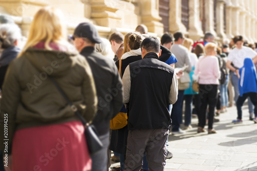 people  queue draggle in line, selective focus photo