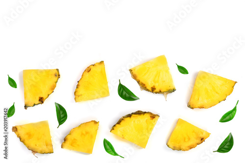 Sliced pineapple decorated with green leaves isolated on white background with copy space for your text. Top view