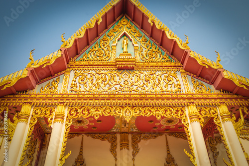 Church door with gold color In Buddhism under the sky