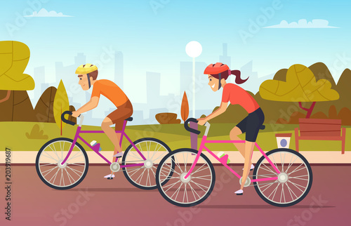 Cyclists male and female rides at the urban park