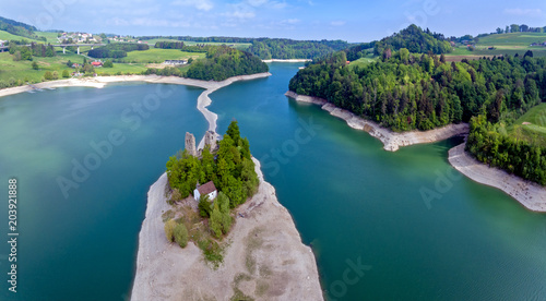  The remains of the castle of Pont (or Pont-en-Ogoz) and a chapel are located on the Ile d'Ogoz, one of the five islets of the Lake Gruyere in the Canton of Fribourg, Switzerland.