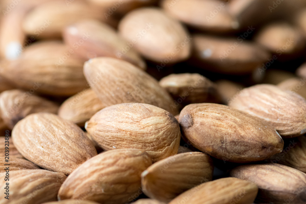 Nuts, almond, tasty and healthy food with lots of vitamins. Almond nuts Closeup view, selective focus Nuts, almond, tasty and healthy food with lots of vitamins. Almond nuts Closeup view, selective focus