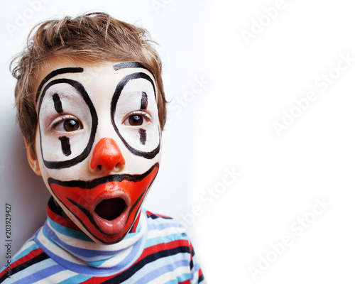 little cute real boy with facepaint like clown, pantomimic expre photo