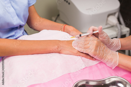 cosmetology and beauty concept - Anti-age injection therapy  hand rejuvenation