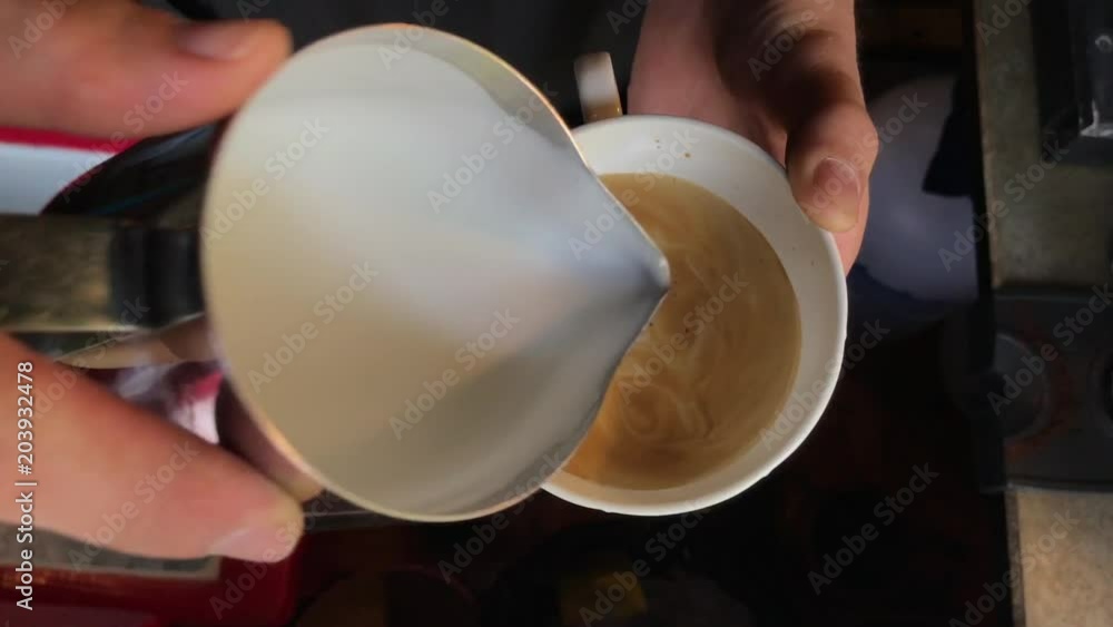 Barista making coffee latte art. Barista making coffee latte art.