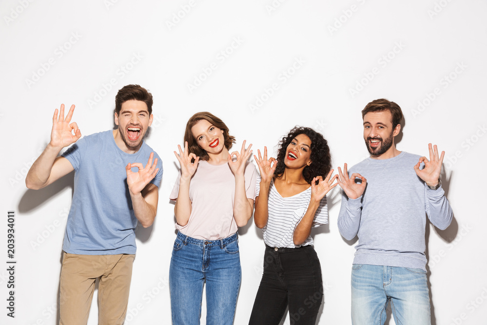 Group of happy multiracial people showing ok gesture Group of happy multiracial people showing ok gesture